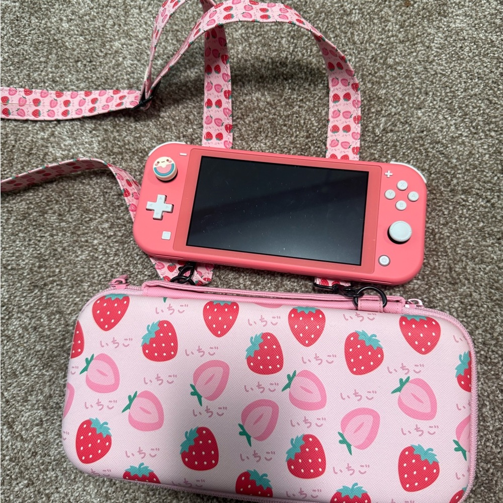 Coral Nintendo Switch Lite with Strawberry Case